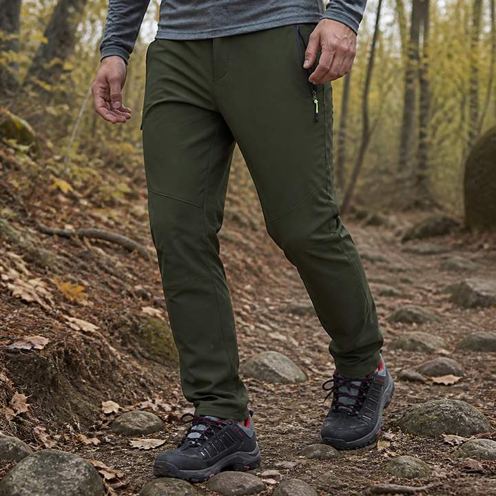 Men's Army Green fleece-lined hiking pants on an autumn trail