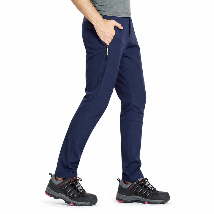 Men's fleece-lined windproof hiking pants in navy, left-side angle